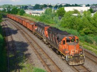 CN 596 is westbound towards Taschereau Yard with what were described as 'rush' ballast loads, possibly for a derailment on the La Tuque Sub.