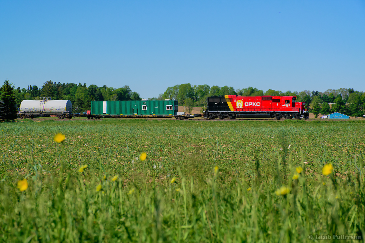 Closing in on a crew change at Guelph Junction, CPKC's weed spray train cuts across the farmland near Progreston.
