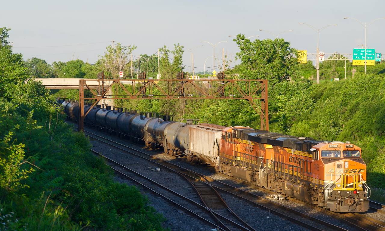 One of the most photographed trains on CN's Kingston/Montreal Subs in some time passes CN Ballantyne with the foreign power on the tail end of ethanol train CN 714 (mostly) avoiding the lengthening shadows. This train had an unusual configuration of one NS unit up front and two BNSF units on the tail end.