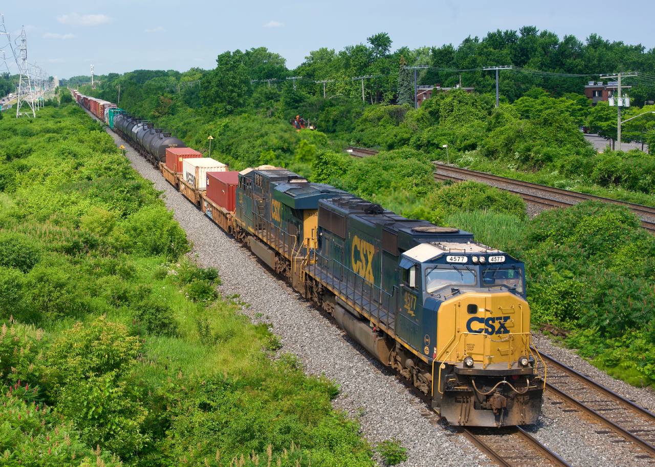 An SD70MAC leads on off schedule CN 326 eastbound on the Kingston Sub on Canada Day.