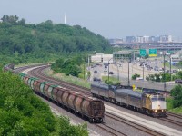 VIA 603/601 passes a cut of MGLX cars on Canada Day.