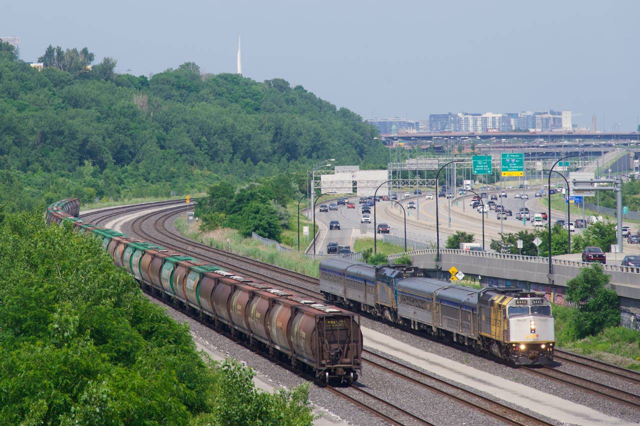 VIA 603/601 passes a cut of MGLX cars on Canada Day.