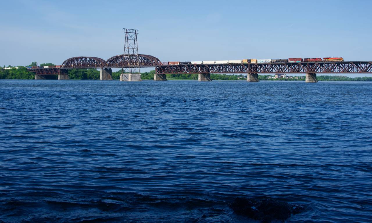 CPKC 229 approaches the island of Montreal. Power is KCS 5000 & CP 9758, which had gone south on grain train CPKC 528.