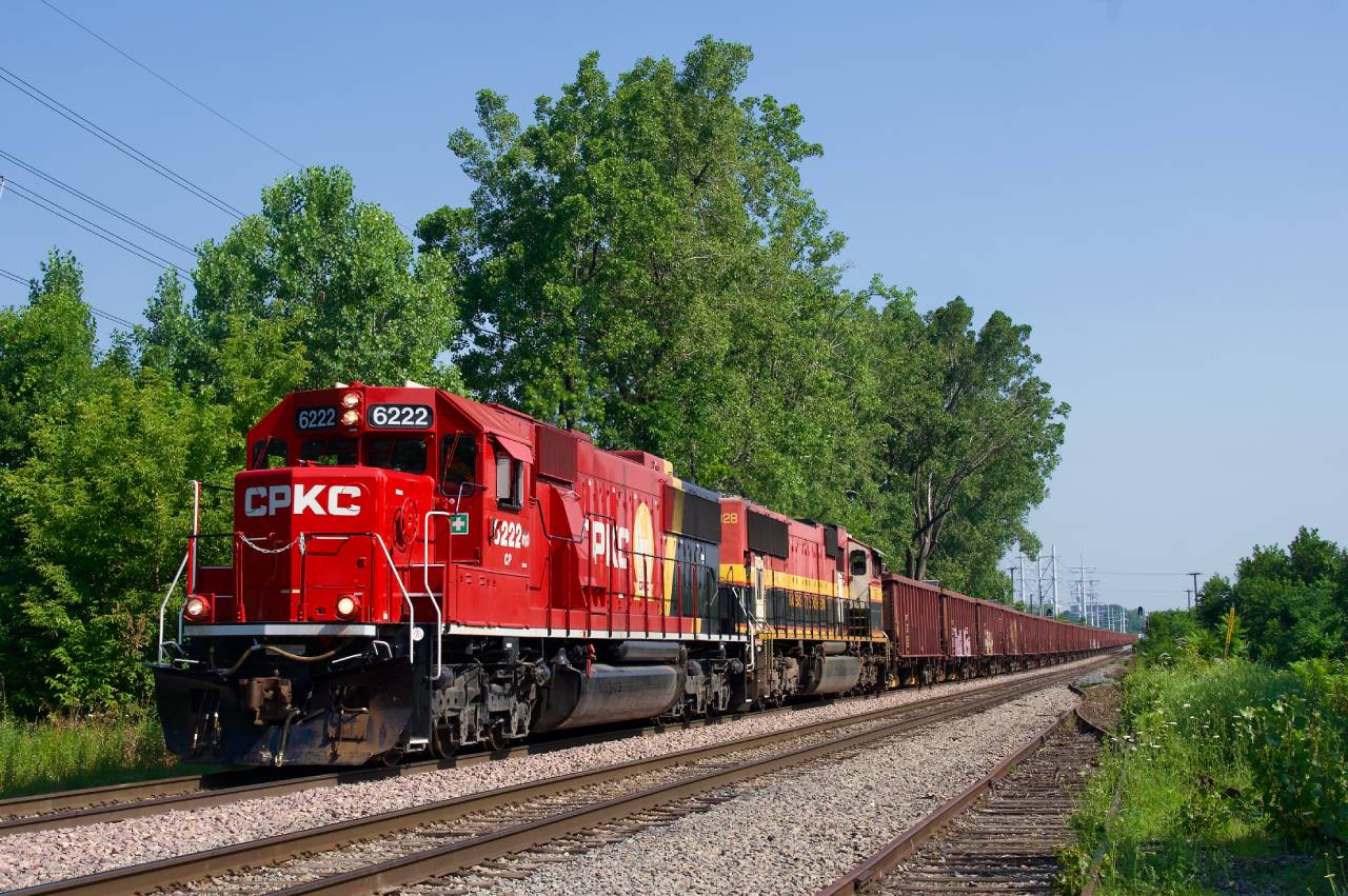 CPKC 9WCA-10 is southbound through LaSalle with ballast loads for the D&H. Power is CP 6222 & KCS 3928.