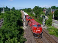 CPKC 230 splits the signals with new ET44ACs CP 7600 & CP 7553 for power and a lot of autoracks up front. Behind is some intermodal traffic and then a very small amount of mixed freight.
