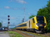 VIA 633 with the Lumi consist is about to knock down a Limited to Clear signal at Coteau Jct as it prepares to leave the Kingston Sub for the Alexandria Sub.