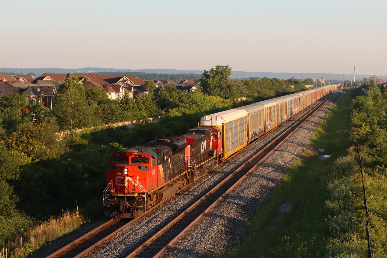 E275 operating on what is now the North Track at Mile 37.7 Halton Sub., about to pass under Louis St. Laurent Ave. with 94 cars trailing through the start of double track at Derry and onto the single track between Derry and Milbase.