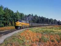 The weekend of September 13 - 15, 1963 marked a massive undertaking by the Upper Canada Railway Society, a 692.2 mile excursion from Toronto - Ottawa - North Bay - Temagami - Toronto, with seventeen coaches behind CNR 6167. With the train having run overnight from <a href=https://www.railpictures.ca/?attachment_id=57853>Toronto - Ottawa on the 13th,</a> the train turned west and <a href=https://www.railpictures.ca/?attachment_id=55181>departed the nation's capital</a> early on the 14th. 6167 would be removed at North Bay, with ONR FP7s <a href=https://www.railpictures.ca/?attachment_id=56096>handling the train to Temagami overnight.</a> The consist returned to North Bay on the morning of the 15th, with 6167 taking over once again for the return to Toronto.

<br><br>About halfway back to North Bay from Temagami, passengers have detrained for a runpast, as the pair of green and yellow FP7s round the curve at approximately mile 31.5, roughly the area of the settlement of Jocko.  <i>[Geotagged located not exact]</i>

<br><br><a href=https://www.railpictures.ca/?attachment_id=54757>Running across northern Ontario</a>
<br><br><a href=https://www.railpictures.ca/?attachment_id=54806>Arrival at North Bay.</a>

<br><br>Further information will be detailed in upcoming posts, but can also be found in the <a href=https://railwaypages.com/upper-canada-railway-society-ucrs-and-its-publications>December 1963 UCRS news letter.</a>

<br><br><i>Scan and editing by Jacob Patterson.</i>