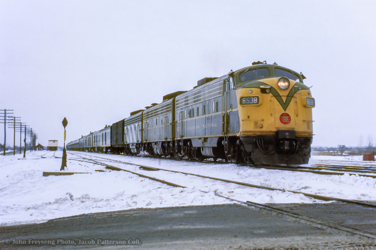 CNR pool train 14, the "International Limited," is seen departing Belleville for Montreal behind an A-B-B set of GMD FP9 locomotives.

John Freyseng Photo, Jacob Patterson Collection Slide.