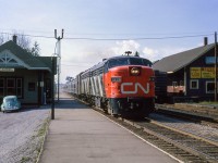 Toronto - North Bay train 41 flies through Aurora northbound towards the next stop at Newmarket.

<br><br><i>Scan and editing by Jacob Patterson.</i>