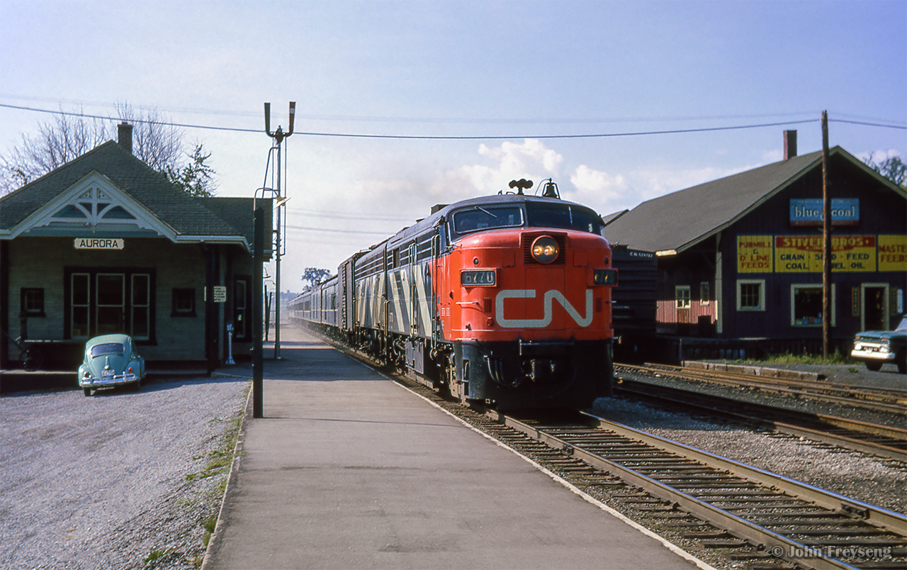 Toronto - North Bay train 41 flies through Aurora northbound towards the next stop at Newmarket.

Scan and editing by Jacob Patterson.