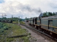 Turning around from <a href=https://www.railpictures.ca/?attachment_id=57538>the previous view,</a> train 52, the Super Continental, is seen having just departed Washago, taking the Newmarket Sub towards Toronto.  At left, train 409 waits to continue to Capreol behind CN 4568, CN 4560, CN 4573.

<br><br><i>Scan and editing by Jacob Patterson.</i>
