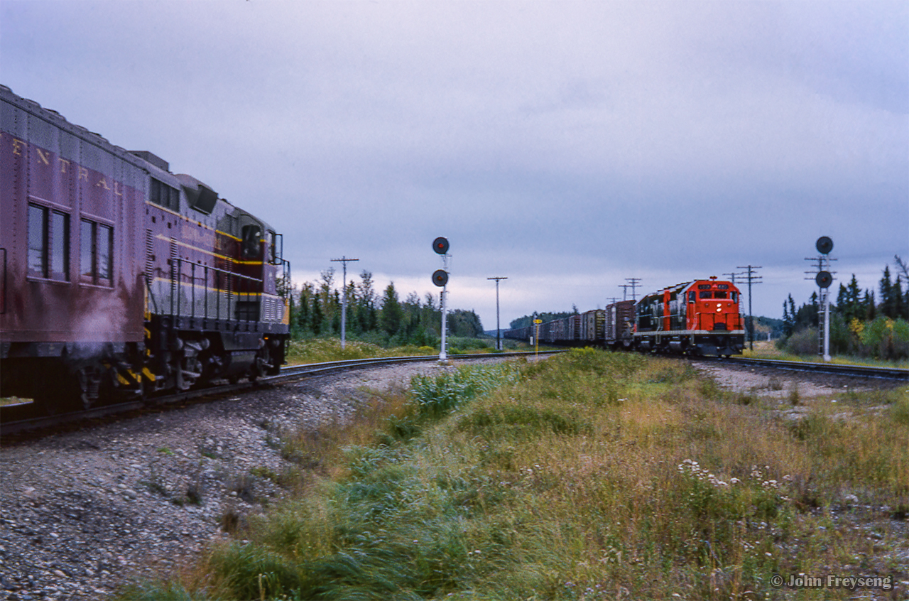 Algoma Central Hearst - Sault St. Marie train 2 pauses at Oba to wait for a westbound CN freight to clear the diamond on the Ruel Sub.  Leading the westbound is the only two GP35 units purchased by CN, 4001 and 4000, recently released from GMD London.

Pausing at the station
<a href=https://www.railpictures.ca/?attachment_id=59048The head end

Scan and editing by Jacob Patterson.