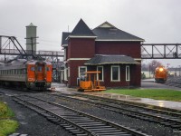 Operating as extra 6354, former train number 668 - the southbound RDC-2 passenger car from Owen Sound- is seen arriving at Palmerston, where RDC-1 6101 sits nosed up to CN 6118 on the Newton Sub side of the station on Saturday, October 24, 1970. Both 6101 and 6354 will be combined, and will depart at 0715h for the trip to Toronto (formerly train 658) via the Fergus, Guelph, Halton, and Weston Subs. Extra 6118 will too depart at 0715h for Stratford.

<br><br>The official last runs of the RDC service to Owen Sound, Kincardine, Southampton, and Goderich was the evening of Friday, Oct 23, 1970. Though these services continued to operate to Toronto (and Stratford) as extras until the end of the month. Daylight saving time ended early Sunday morning, Oct 25, 1979, and CN and CP would bring out their winter timetables at this time change.

<br><br><i>Scan and editing by Jacob Patterson.</i>

<br><br>More shots from this date:
<br><a href=https://www.railpictures.ca/?attachment_id=45100>Extra 6101 arriving at Palmerston</a>
<br><a href=https://www.railpictures.ca/?attachment_id=55090>Extra 6101 spotted on the Newton Sub</a>
<br><a href=https://www.railpictures.ca/?attachment_id=48776>Extra 6354 arriving at Palmerston</a>
<br><a href=https://www.railpictures.ca/?attachment_id=50370>All three RDCs lined up at the station</a>
<br><a href=https://www.railpictures.ca/?attachment_id=56794>Waiting on the Newton Sub</a>