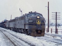 Rolling eastbound into Agincourt Yard, Extra B&O 4487 (class lights lit) approaches the north platform at <a href=https://www.trha.ca/history/stations/agincourt-station-canadian-pacific-railway/>Agincourt station</a> with a short cut of autoracks. Taken in mid-late February, the lease of B&O F units began only just before this <a href=https://www.railpictures.ca/?attachment_id=29413>on February 10, 1972.</a>  <br><br>More information on the lease of B&O F units <a href=https://www.railpictures.ca/?attachment_id=29413>can be found here.  <br><br><a href=http://www.railpictures.ca/?attachment_id=58946>Approaching the scene.</a>  <br><br><i>Scan and editing by Jacob Patterson.</i>