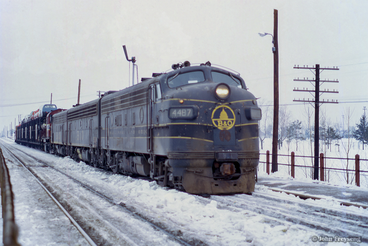 Rolling eastbound into Agincourt Yard, Extra B&O 4487 (class lights lit) approaches the north platform at Agincourt station with a short cut of autoracks. Taken in mid-late February, the lease of B&O F units began only just before this on February 10, 1972.

More information on the lease of B&O F units can be found here.

Scan and editing by Jacob Patterson.