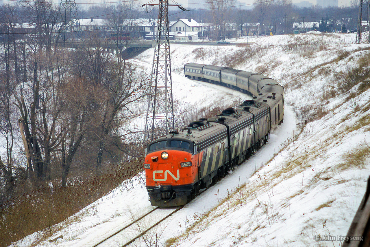 On February 11, 1972, a derailment at Morrisburg on the Kingston Sub  and resulting propane tank explosions shut down the mainline for a short time forcing CN trains to detour via the CPR.  Rounding the curve on approach to Leaside at the top end of the Don branch of the Belleville Sub, CN 50, the Rapido, is just one of many detours.
Scan and editing by Jacob Patterson.