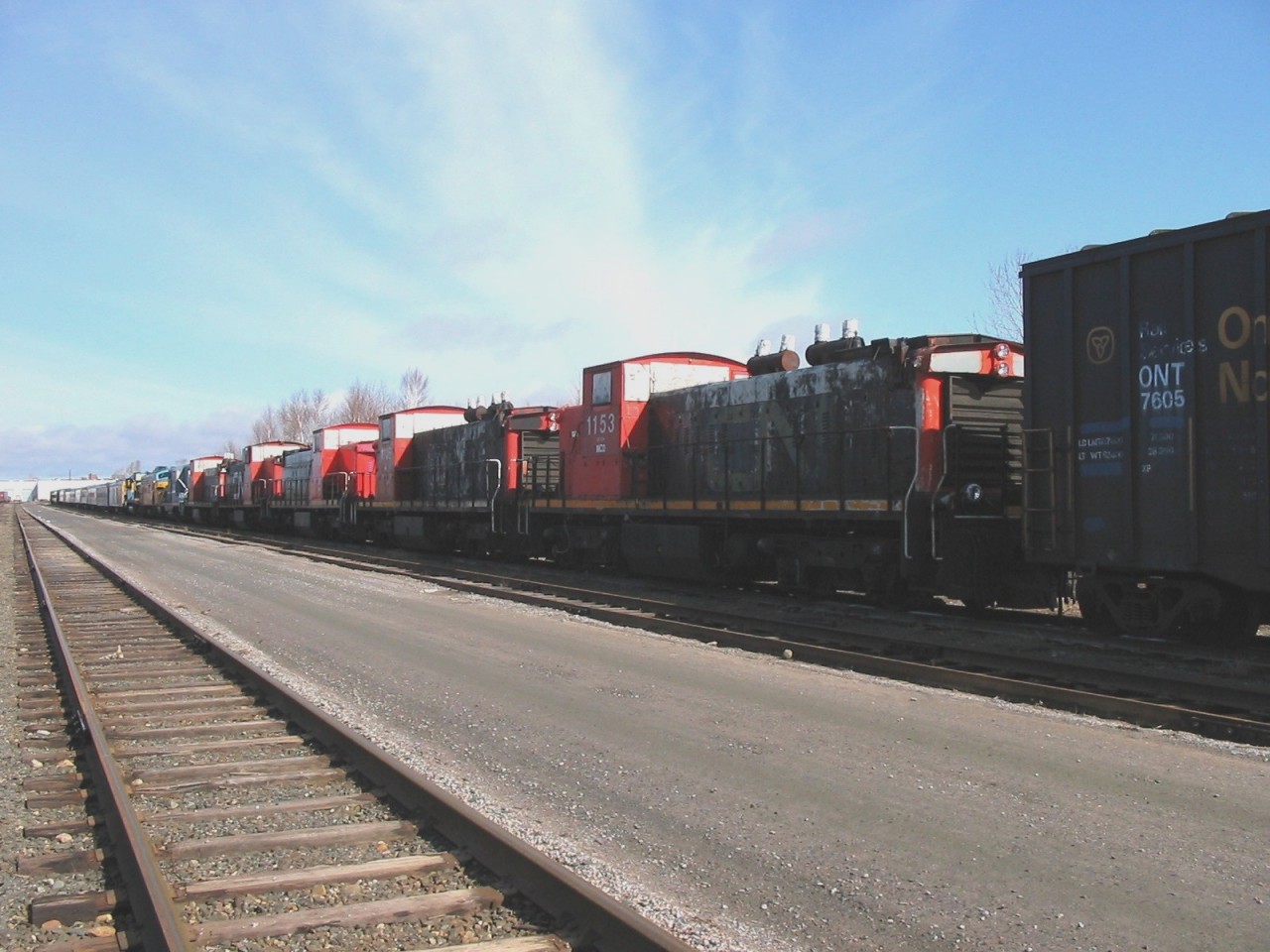 Foreign colours in the lineup  
Five ex-CN GMD1's are tucked into a string of retired ONR locomotives, passenger cars, and other rolling stock in an ONR deadline at North Bay, ON May 4, 2004. 
Several of the ex-CN units were stenciled INCO on the side of the cab under the running number. 
The ex-CN units in the lineup were CN 1116, CN 1153, CN 1169, CN 1170, and CN 1172.