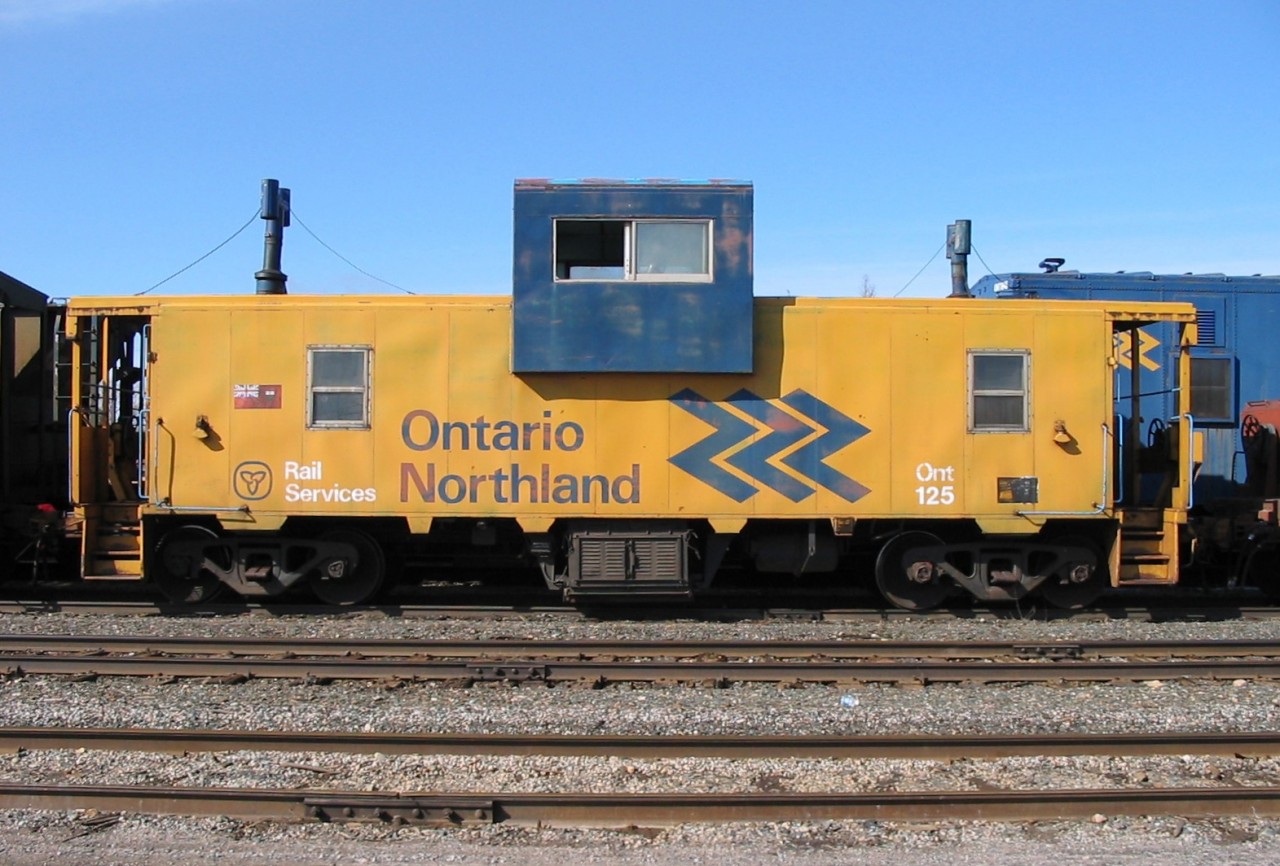 Tall stack, short stack  
ONR van ONT 125 sports a tall smokestack and a short smokestack in its later years as it rests in the deadline at North Bay, ON May 4, 2004.