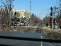 3/19/16. My  Mac Yrd bound train has just crossed over the diamond at Brampton,Ont on CN's Halton Sub as we meet a  westbound freight lead by ex AT&SF "gull wing" C40-8W(ATSF 841 BNSF 841 ). Now numbered CN # 2182. I was so happy when the company put in a 
One Way Low Speed / OWLS" diamond, so the CN trains no longer had to do 30mph(50mph now)  crossing the old diamond. The diamond at Carew on the Dundas Sub also has an OWLS crossing.(60mph)