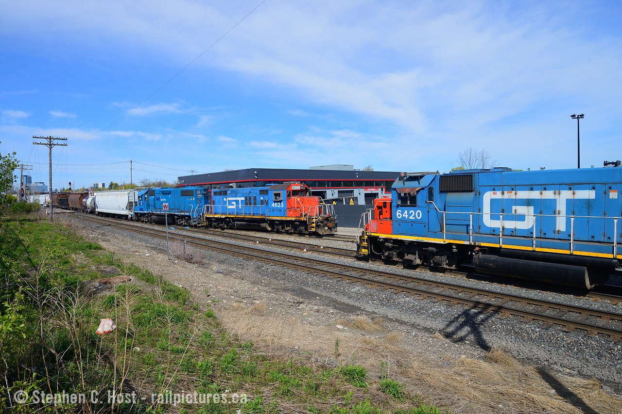 When this GP9 arrived in Kitchener the local railfans were all hot for what it could go on. It's been decades since a GT GP9 was around Kitchener. The next day we found 542 switching Kitchener yard with the 6420/9449 and hoped that perhaps 540 would take the GP9 set later in the morning. After switching the yard for an hour 542 would park 6420/9440  along the fence line, and swapped to the 4623 set and the plan was to shove out of the yard and follow the GO train out to Guelph, allowing 3 of us to get this shot. 540 would take the 6420 set instead later in the morning. For about two months that 6423 was in the area the foam was very very strong, and now the unit was sent back to mac, and onward to Montreal where it now works. Get your shots, there's very few of these GT GP9's left on the roster.