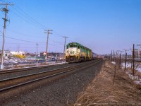 A set of leased GO Transit units head train 505 west out of Montreal passing through Pointe Claire.  It is 1430h on Sunday, March 6, and the units need to be back in Toronto for the Monday morning commuter runs.<br><br>More GO leasers:<br><a href=http://www.railpictures.ca/?attachment_id=39920>1980 Reg Button</a><br><a href=http://www.railpictures.ca/?attachment_id=36340>1985 Arnold Mooney</a><br><a href=http://www.railpictures.ca/?attachment_id=45447>1988 John Reay</a><br><br><i>John Sutherland Photo, Jacob Patterson Collection Slide.</i>