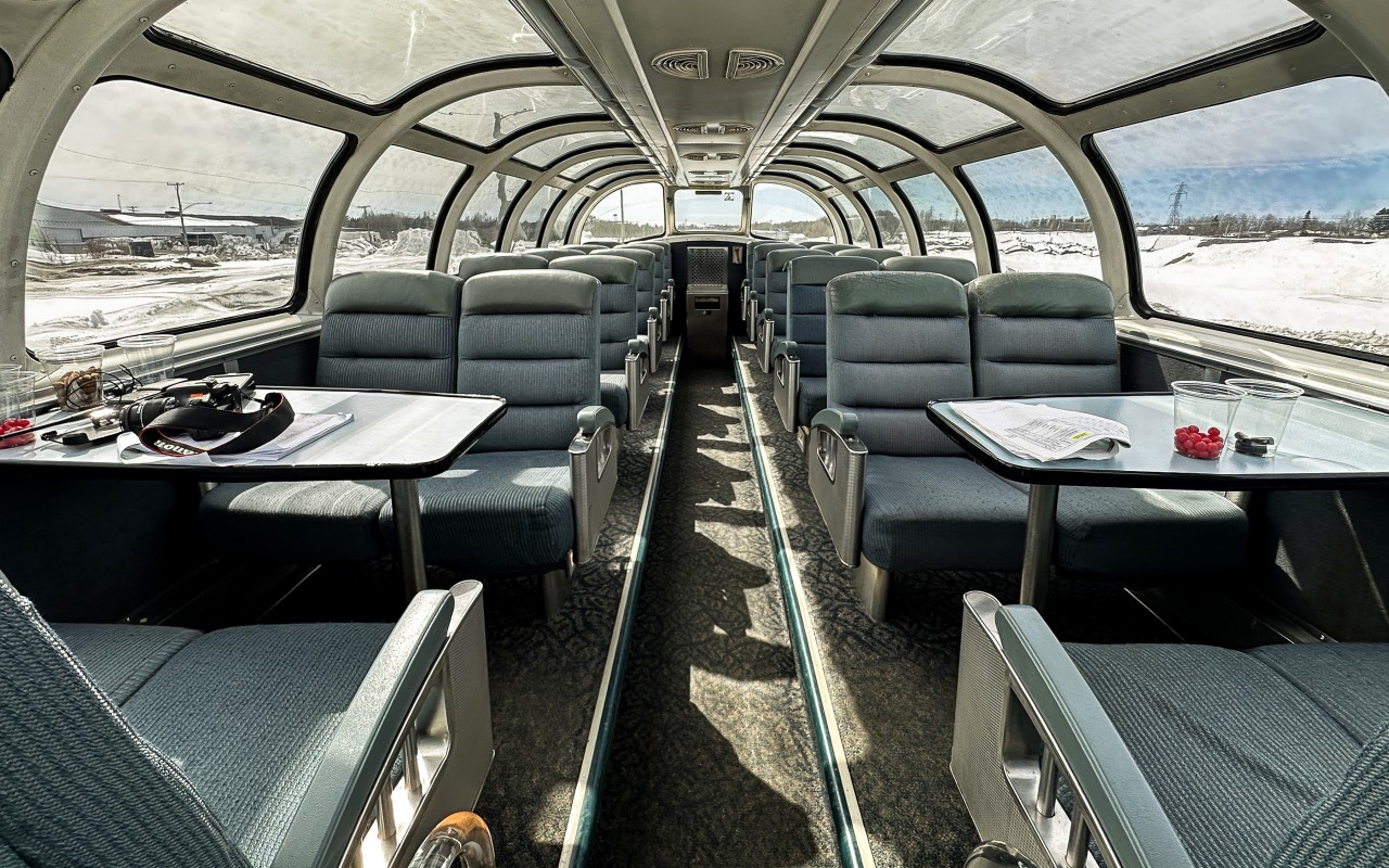 What more could you ask for?  
Camera, radio, timetable, front seats, great on-board service, and no one else in the dome! 
For 90% of my recent trip to and from Churchill April 28 to May 2 I had one of the two front seats with table. 
There were only three people in Sleeper Plus Class allowing for use of 'the best seats in the house' for most of the journey. 
VIA 8503 Skyline was like having my own private car on this trip! :-)