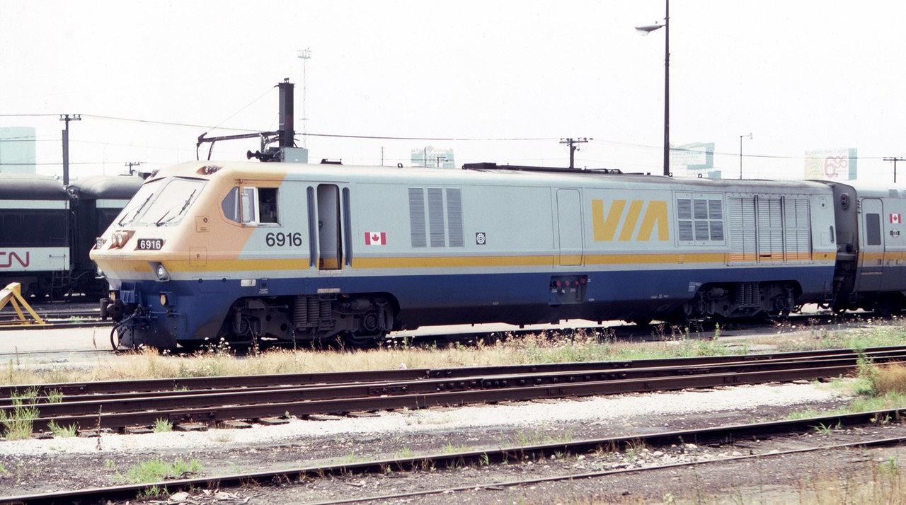 Via MLW LRC 6916 is seen awaiting assignment in the coach yards west of Toronto Union Station in August of 1983.