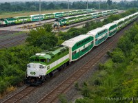Full-house F59-L10 Friday
GO 5127 with newly rebuilt GOT 560 in the lead, passing Gormley layover yard with parked GO 5323 with GOT 562 and GO 5325 with GOT 563 in the background. (2026/07/17)