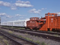 <br>
<br>
What ever happened to the Newfie Bullet rolling stock...
<br>
<br>
...some re-assigned to non-revenue service as Terra Transport work service, Auxiliary & maintenance.
<br>
<br>
Centrally located on The Rock, at Bishop's Falls, August 3, 1982 Kodachrome by S.Danko
<br>
<br>
Plow #3468, Flanger #3678 and next two are bunk cars (#50xx) and the box car red coach in the distance is CN #5013 ' Bunk Kitchen & Dining Car'
<br>
<br>
Main, trans – Island, track in the foreground.
<br>
<br>
sdfourty