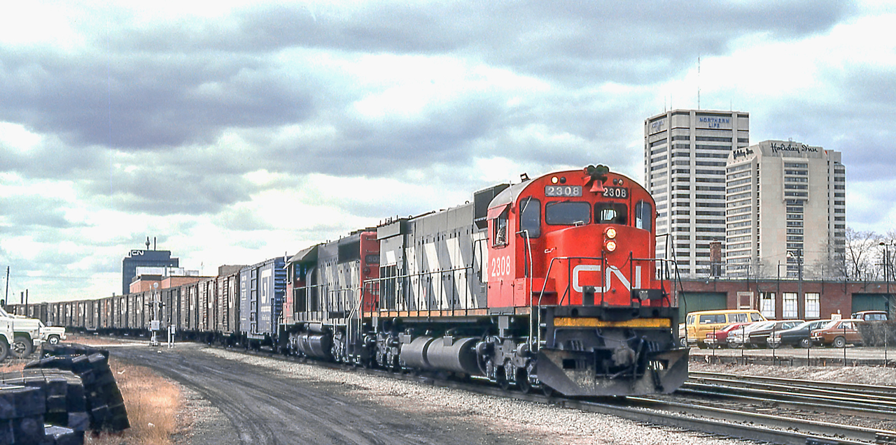 CN 2308 is eastbound in London, Ontario on March 25, 1981.