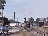<br><br> Exercising track rights, <br><br> with a 'red over yellow' restricting  semaphore signal cleared by the BX  tower. <br><br> B & O  3767 East enters  Canada Southern territory,<br><br>  BX Tower, St. Thomas, September 15, 1985 Kodachrome by S.Danko<br><br>     <a href="http://www.railpictures.ca/?attachment_id=  59254 "> awaiting the C & O   </a><br><br> Noteworthy<br><br>Chessie System (holdco) owned C & O; B & O; WM; B&OCHR, and trains operated with the Chessie System name 1973 to 1987.<br><br>CSX Corporation created November 1980 with merger of Chessie (the holdco) into SCL. The railroads continued to operate independently, then in December 1982 the Family Lines merged into SCL; 1983 WM merged into B&O;  CSX livery introduced  1986; April 1987 B&O merged into C&O; August 1987 C&O merged into CSX Transportation, the latter being a re-named Seaboard System, and  the Chessie System name retired.<br><br>sdfourty