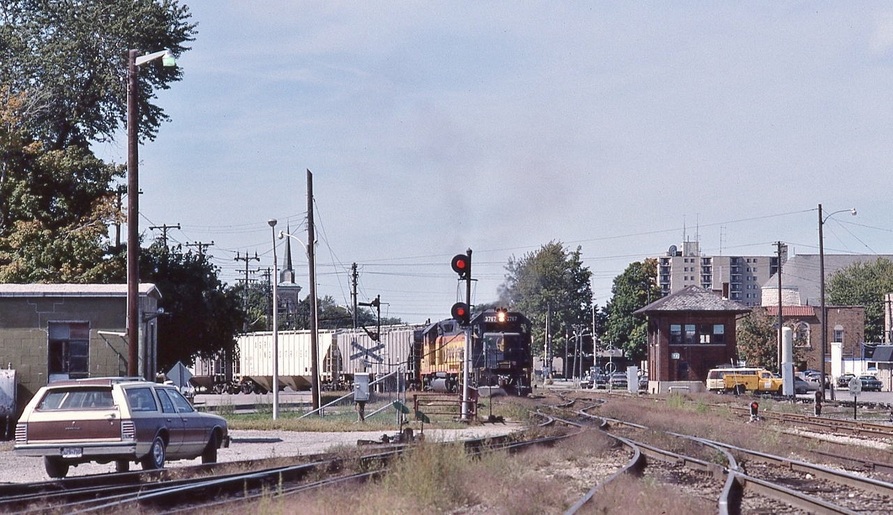 Exercising track rights, 


 with a 'red over yellow' restricting  semaphore signal cleared by the BX  tower. 


 B & O  3767 East enters  Canada Southern territory,


  BX Tower, St. Thomas, September 15, 1985 Kodachrome by S.Danko


      awaiting the C & O   


 Noteworthy


Chessie System (holdco) owned C & O; B & O; WM; B&OCHR, and trains operated with the Chessie System name 1973 to 1987.


CSX Corporation created November 1980 with merger of Chessie (the holdco) into SCL. The railroads continued to operate independently, then in December 1982 the Family Lines merged into SCL; 1983 WM merged into B&O;  CSX livery introduced  1986; April 1987 B&O merged into C&O; August 1987 C&O merged into CSX Transportation, the latter being a re-named Seaboard System, and  the Chessie System name retired.


sdfourty