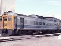 Via RDC 6207 is seen at the west end of Toronto Union Station in July of 1982. The gold-colored Royal Bank Tower is seen in the background across the street. The twin towers have real 24 karat gold in the windows, hence the gold color.