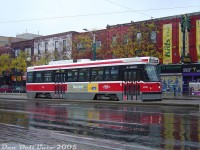 TTC CLRV 4032 heads northbound on a Route 510 Spadina run approaching College Street in the rain, passing the El Mocambo, a longtime popular event venue in this area of Toronto whose classic neon sign marked this stretch of Spadina Avenue for decades. The wet glossy pavement adds a nice touch, even if the streetcar reflection is incomplete.<br><br>4032, built in 1979, lasted a good 40 years in service before it was finally retired in February 2019 and sold for scrap. The 4032's side ad advertises a successful career upon attendance of some place called Ryerson University, a name that the El Mocambo, despite all its recent ownership woes, has managed to outlive.