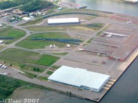 Here's a treat for VIA passenger car fans: all 33 of the unused Nightstar passenger car shells, that never joined VIA's Renaissance fleet, stored in Thunder Bay on various tracks around Keefer Terminal. Most are visible parked in small groups (I count 29), but 4 are hiding behind one of the warehouses on the upper right. Some maintenance of way equipment is also visible scattered here and there.<br><br>A total of 139 cars built for the proposed-but-not-realized UK "Nightstar" overnight service through the Channel Tunnel were acquired by VIA Rail in 2000, after being built and stored for a number of years. As I understand it, there was some political pressure to purchase these cars for a song, but there were a number of compatibility issues between them and North American rail standards. They were sent to Thunder Bay where 106 were modified by Bombardier into various types of cars to operate in VIA service as their "Renaissance" fleet. The 33 remaining shells were stored here at Keefer Terminal near the Bombardier plant for possible future conversion, but no further cars were ever needed or rebuilt. <br><br>The stored cars languished here until they were removed from Keefer terminal a year later in August 2008, lifted from their trucks, and the bodies stored in a field nearby. All were then cut up for scrap. Judging from some photos posted of their insides, it appeared they were just empty shells with no interiors installed (there's another RP.ca member who did time in Thunder Bay who may have more photos of the ordeal).