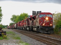 Maximum power required? The lowly Canadian Pacific #T56 transfer job (West Toronto-Toronto Yard) puts in an evening appearance at Bartlett Avenue along CP's North Toronto Sub with an impressive set of GMD units piled on today: a "Big Mac Attack" up front with CP SD9043MAC units 9127 and 9120, and four classic SD40-2's 5874, 5801, St.L&H 5560, and 5908 following. The trailing units may or may not have been online, but it made for a nice catch anyway.<br><br>Those 4300 horsepower SD9043MAC units were built with 710G engines as "convertible" units, to be re-engined and converted to 6000 horsepower when EMD's new 4-cycle 265H engine was ready. The process however was more complicated than originally thought (and CP's four H-engine'd 9300's did not perform to impress) so none were ever converted. The SD70ACu rebuilt program later came along as a more practical solution to the SD90MAC's problems.<br><br><a href=http://www.railpictures.ca/?attachment_id=16486><b>5560</b></a> was one of those wreck replacement units included in CP's many SD40-2 orders, built new to replace units Ogden couldn't pull out of the shop's scratch and dent bin to fix. As per notes by the late Bruce Chapman, the original SD40 5560 was wrecked in a grade crossing accident with a government motor grader in Saskatchewan in April 1980, and the government of Saskatchewan paid to "fix it", which ultimately resulted in CP ordering a new Dash-2 replacement unit in their next SD40-2 order and numbering it in its place as CP 5560(:2). The old 5560 remains were scrapped at Angus Shops the same year in 1981.