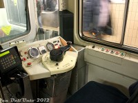There's a lot of photos of TTC T1 and TR cab interiors floating around, but not many of the old <a href=http://www.railpictures.ca/?attachment_id=3833><b>Hawker Siddeley H5's</b></a>, so here's a cab-view of TTC H5 5759 during a quick rush-hour pause at Union Subway Station while it was in service as the guard car.<br><br>All the fun bits are here, including speed and air pressure gauges, DC ammeter, indicator lights, a big red button (don't push!) for the horn, a smaller red button to uncouple the car (don't touch!), the communications unit, a seat (don't sit!), the manually-cranked run number box mounted in the front window, the right side door control panel with door opening and closing buttons (don't press!), an opening window for the guard to poke his head out of (don't poke), and the large WABCO controller arm that needs to be pushed down (as a deadman feature) and rotated to the correct throttle setting for operation. The CN/VIA Turbo Trains used a similar throttle arrangement, as did the MLW/Bombardier <a href=http://www.railpictures.ca/?attachment_id=19928><b>LRC demonstrator JV1</b></a>, and the HSC-built Montreal Expo Express trains. The reverser lever can be seen mounted on the gold chain in the pouch below (it would be inserted in the reverser slot below the main panel if the car was leading)<br><br>All the old now-retired Hawker/UTDC equipment used the same basic controller setup, but by the T1's they switched to a T-style controller lever that carried over to the TR's.<br><br>There's some good in-cab footage of an H1 operating in the 1998 TV-movie version of <a href=https://www.youtube.com/watch?v=B9PfhyHfXCE><b>"The Taking of Pelham 1-2-3"</b></a> filmed in Toronto using an old H1 subway car, and featuring a surprisingly notable cast including Vincent D'Onofrio, Lorraine Bracco, and Richard Schiff (would someone please get that guy a bottle of cough syrup).