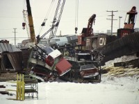 To my knowledge nobody has posted any photos from the Burlington "Mainway" wreck of early January 1977. So then, here's one. This negative was in rough shape, but still fared better than the subjects.
This was a Toronto to Fort Erie train. Thirty-seven cars of an 87 car train went on the ground January 19th when a car carrying sulphur suffered wheel seizure. Lumber, sulphur, vehicles and scrap were scattered all over the place in this derailment that happened between Walker's Line and Guelph Line. Damage estimated at more than $2 million.
For those who would like to know, the engineer was John Misener of Niagara Falls, head brakeman was Ray Beroud of Stevensville. Terry Illingworth of Fort Erie and another (unidentified) were in the caboose.
Two of the hooks on the job I made note of were CN 50014 and 50019. Work train led by CN 4585.