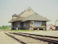 Nothing glamorous about the backside.  Thats the first thing that comes to mind looking at an image of the old CN Wingham station from the rear. At the time of the photo, this structure was occupied by Harkema Express, a trucking outfit. Tracks ran on both sides of the building back in the day. Passenger service ended in 1973 and the line abandoned in 1991. Currently the old station has been restored and in use.