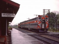 Pity it is a rainy afternoon, but still nice to catch CP 4070 with commuter bi-levels heading eastward toward Montreal.  I'm wondering when the nice old Vaudreuil-Dorion station lost it's life.  Anyone?