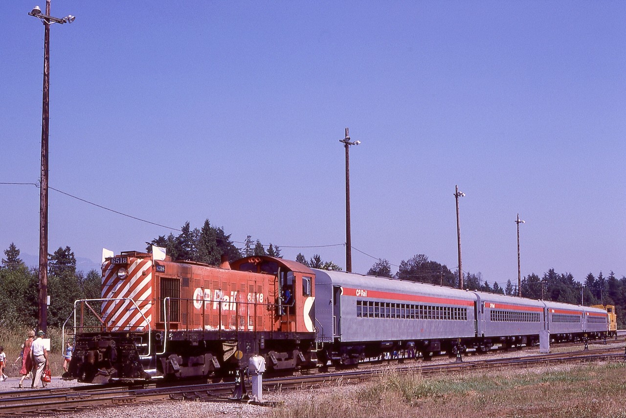 In recognition of a century since the company was founded, Canadian Pacific organized Family Days open house opportunities at significant facilities for employees, and at Coquitlam Yard in Port Coquitlam, that included train rides on the X-Yard running lead.  On Sunday 1981-08-09, MLW S-4 CP 6518 with three coaches and a caboose took riders from the west end of the yard to the east end and back on a hourly schedule.