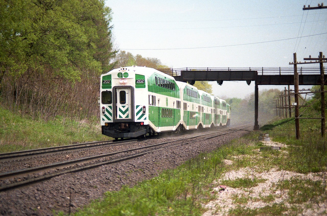 I forget the reasons, but occasionally we would see GO power substituting for VIA here and there. Sometimes just the locomotives, sometimes a trainset, as seen here.
I suspect VIA was power short.  Could be due to issues with the LRCs that were relatively new and supposed to carry the load for the passenger service.
In this shot, cab leading, the rear unit is 510; and this is the old Inksetter Rd bridge before it went under structural changes to support increasing road traffic.
I marked my notes as this being VIA #73. Perhaps someone has other information regarding GO on VIA.