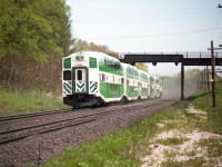 I forget the reasons, but occasionally we would see GO power substituting for VIA here and there. Sometimes just the locomotives, sometimes a trainset, as seen here.
I suspect VIA was power short.  Could be due to issues with the LRCs that were relatively new and supposed to carry the load for the passenger service.
In this shot, cab leading, the rear unit is 510; and this is the old Inksetter Rd bridge before it went under structural changes to support increasing road traffic.
I marked my notes as this being VIA #73. Perhaps someone has other information regarding GO on VIA.