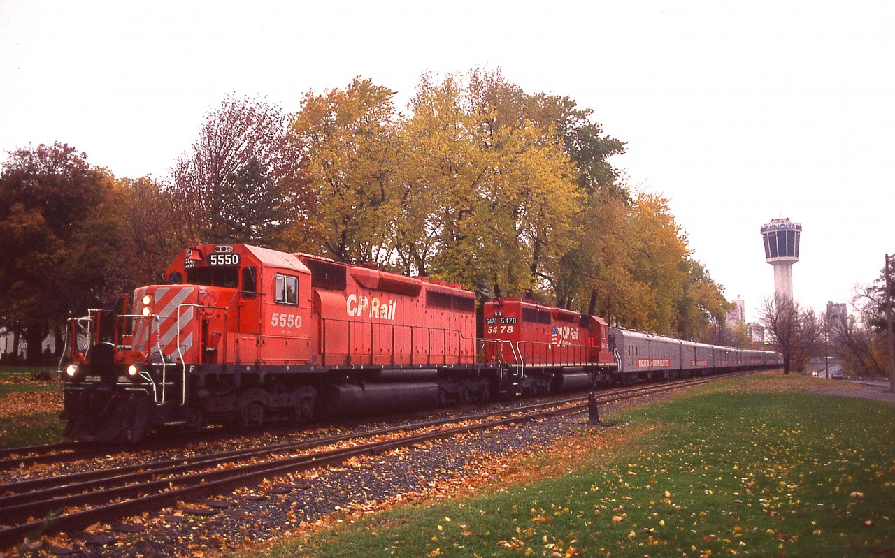 It has been long enough already that most of us have forgotten about the once popular Circus Train that made stops all over North America. And many of todays fans weren't even old enough to hold a camera since it last made Niagara back in 1994.
I posted a Circus Train shot here approaching the South Siding Switch, Chippawa, a long time back with telephoto, I switched cameras; then backpeddled like mad in order to capture the train using wide angle. Back then, my tele and wide angle meant using two different cameras; unlike todays easy digital.
Interesting shot, though, of a train and location long forgotten.
Due to the poor weather, Reg Button was the only other photographer with me in this afternoon of scurrying.
But it all paid off, as this is the last Circus Train I have ever seen.  
The track in the foreground is still in place as the South Siding Switch for the twice weekly local out of Welland that comes down to service business at Chippawa. Track to downtown Niagara Falls was removed by 2001.
Niagara Falls has grown its tourist industry to the extent I don't even think the former Minolta tower is visible from this location, having now been crowded out by hotels.