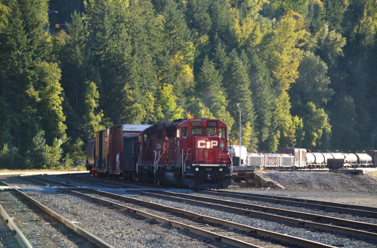 Head of the class CP 5000 assisted by 2291 are seen rolling eastward on approach to the old station at Nelson, BC. The 5000 was delivered to CP on 5/12/2013 from Progress Rail, Mayfield, KY. It is an SD30C-ECO, rebuilt from the old CP 5950. Trailing unit is classed as a GP20C-ECO.
Nelson sure has changed over the years. Besides the loss of that classic Shop facility, it appears downtown to be a refuge for wayward hippies. :o)