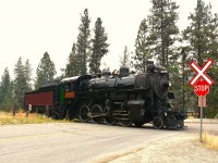 Kettle Valley's steam engine 2-8-0 #3716 is shown here at the closest crossing to the enginehouse and ticket area as it moves to connect with its excursion train to take the enthusiastic riders (inc.me!) on a leisurely 10 mile ride down thru prairie valley to Faulder and back.
As I am typing this up, one of British Columbia's out of control wild fires is threatening this operation. The city of Summerland is under evacuation orders and I understand the railroad has moved as much of its equipment as possible down the line to hopefully get out of harm's way.
It is an extremely serious situation.  We can only hope that the railroad and the city can somehow be spared.