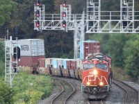 Having set out from Fort Erie, CN422, lead by 3186 ( GE ET44AC )  is chugging her way to Toronto's Macmillan Yard. As she passed under the pedestrian overpass one could certainly feel the heat spewing out of the exhaust. Making up the power along with 3186 was
8318  EMD SD75I ACC
3159 GE ET44AC
3140 GE44AC
