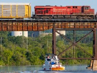 CP 8803 leads a slow eastbound across a busy morning on the Trent River.