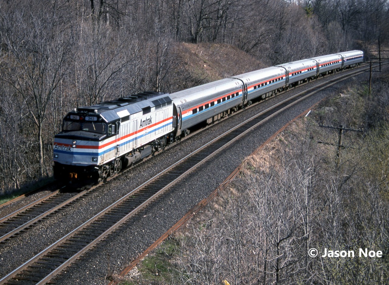 On a spring morning, Amtrak #97 with F40PH 243 is seen approaching Bayview Junction on the CN Oakville Subdivision as it heads to Niagara Falls and eventually the U.S.